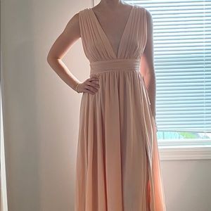 Stunning peach colored dress! Tags are still on the dress, never worn.